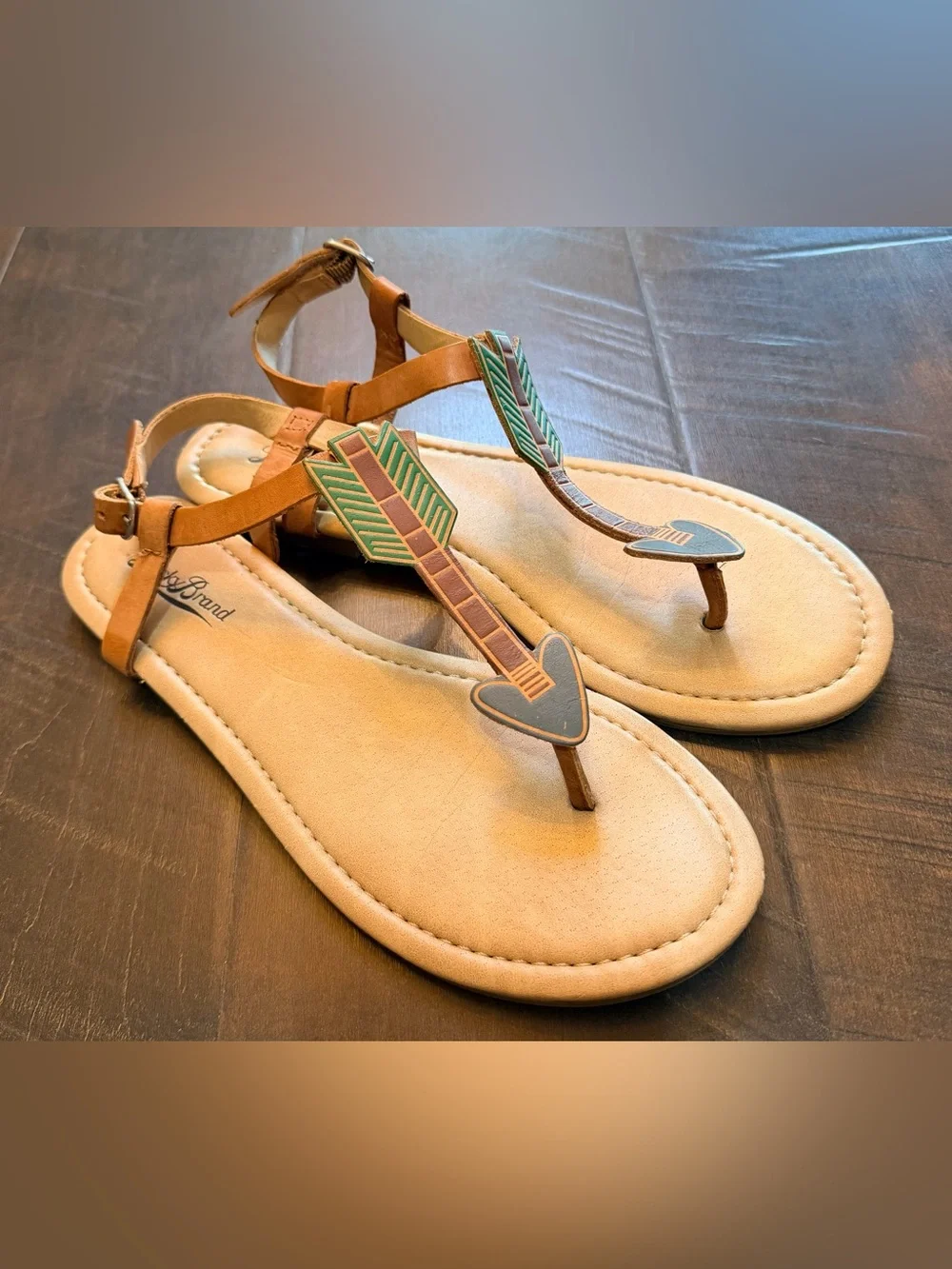 Lucky Brand Tan T-Strap Sandals with Green and Brown Arrow Accents